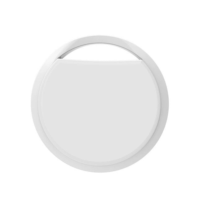En vit rund spårbricka för Google Find Hub