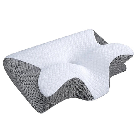 En fjärilsformad kudde med vit ovansida och grå sidopartier